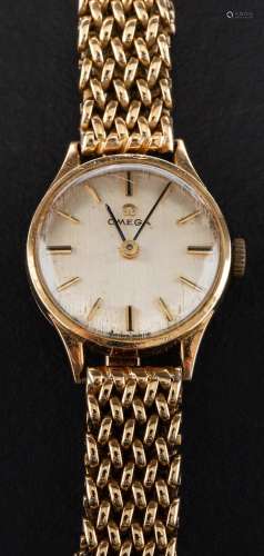 An Omega wristwatch,: the silvered dial with gold coloured b...