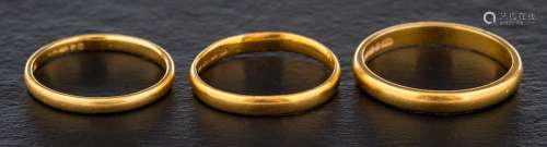 Three 22ct gold bands,: ring sizes L1/2, M and R, total weig...