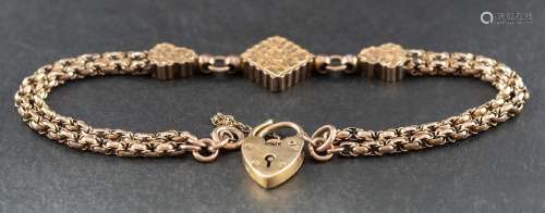 A fancy-link gold bracelet with three foliate engraved panel...