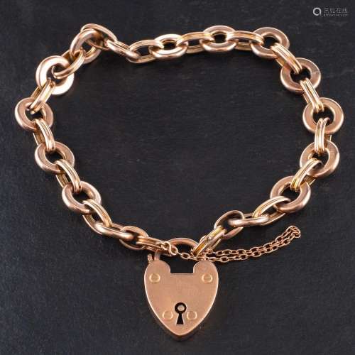 A 9ct gold fancy-link bracelet with heart-shaped fastener,: ...