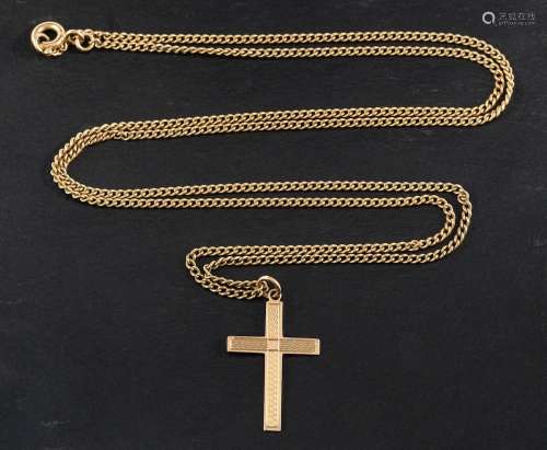 An engine turned cross pendant,: stamped 9CT, length ca. 2.