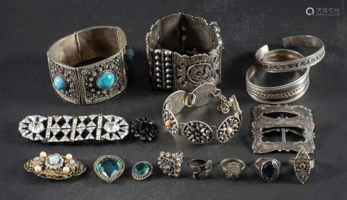 A collection of silver jewellery,: including three bracelets...