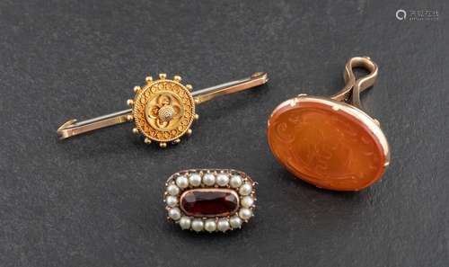 Two brooches and a seal fob,: including an Etruscan revival ...