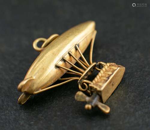 An Airship charm,: with basket and movable propellers, lengt...