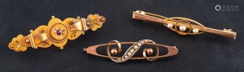 Three gemset brooches,: a synthetic ruby brooch, stamped 15C...