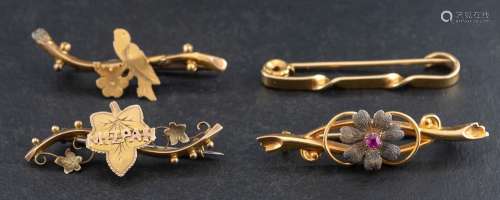 Four bar brooches,: including a 15ct gold and synthetic ruby...