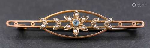 An openwork, seed pearl and blue topaz brooch with stylised ...