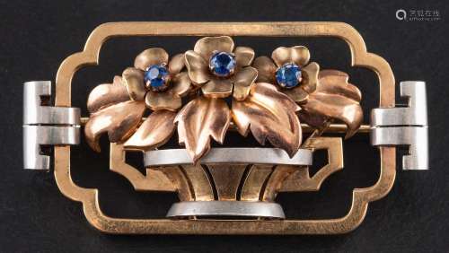 A tri-colour, openwork, jardiniere brooch set with sapphires...