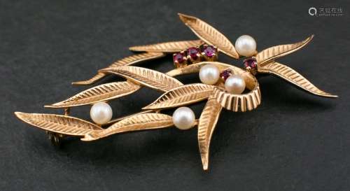 A 9ct gold cultured pearl and ruby brooch of foliate design,...