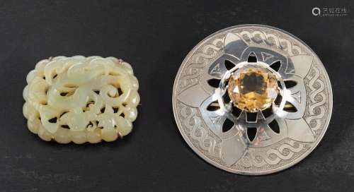 Two brooches,: a Scottish, silver citrine, brooch, estimated...