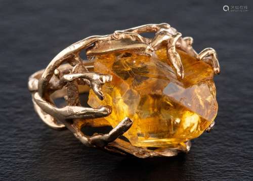 A dress ring set with a citrine crystal,: of organic design,...