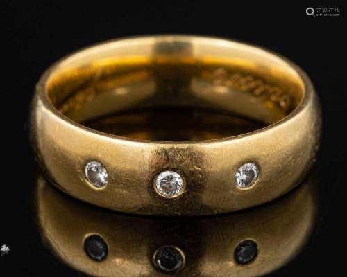 An 18 carat gold and diamond ring,: the polished band set wi...