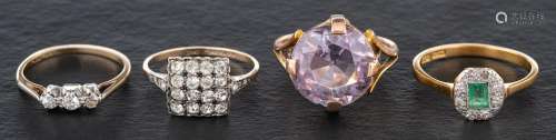 Four gemset rings,: including an emerald and diamond ring, e...