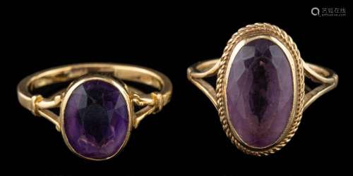 A 9 carat gold amethyst ring,: the oval cut amethyst in a co...