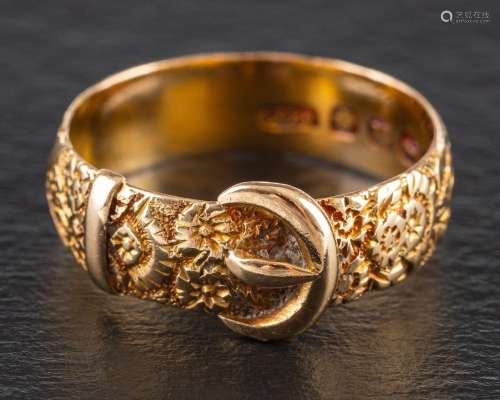 A Victorian 18ct gold buckle ring,: with engraved floral dec...