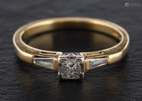 An 18ct gold, princess and tapered baguette-cut diamond ring...