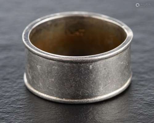 A wide band ring,: stamped PLAT, ring size N, width of band ...