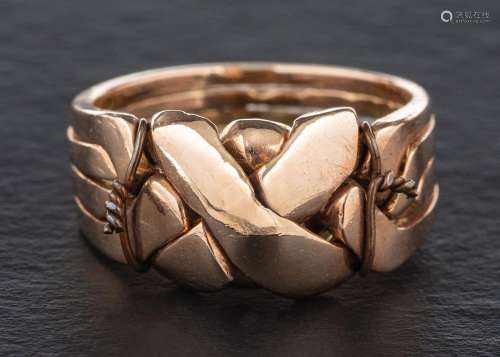 A puzzle ring comprising four interlocking rings,: length of...