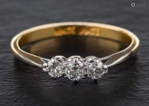 A round, brilliant-cut diamond three-stone ring,: total esti...