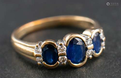 A 9ct gold, sapphire and round, brilliant-cut diamond ring,:...