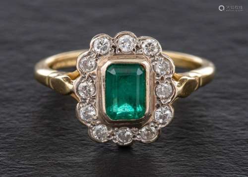 A 18ct gold emerald and round, brilliant-cut diamond cluster...