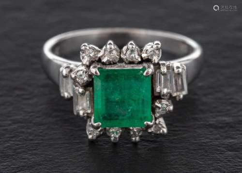 A step-cut emerald, baguette-cut and single-cut diamond clus...