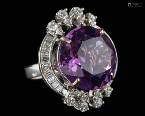 A synthetic colour change sapphire and diamond ring,
