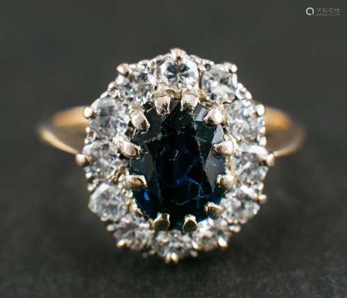 A sapphire and round, brilliant-cut diamond cluster ring,: c...