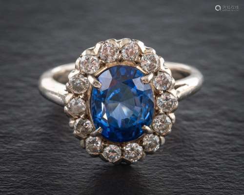 A 18ct white gold, synthetic sapphire and round brilliant-cu...