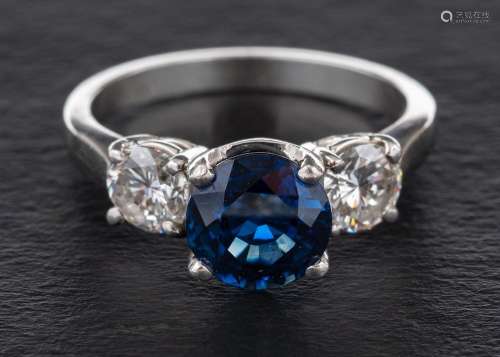 A sapphire and diamond three-stone ring,: calculated sapphir...
