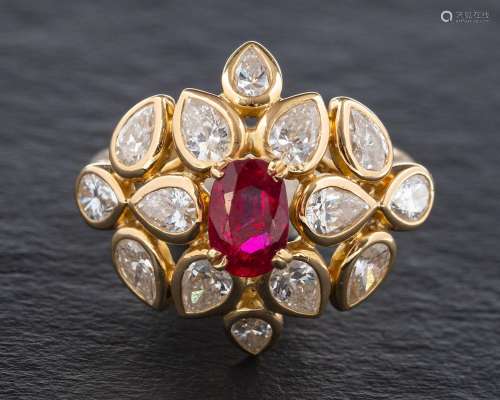 A ruby and diamond cluster ring,: the central oval cut ruby ...