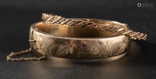 Two 9ct gold bangles,: a ropetwist bangle, hallmarks for Lon...