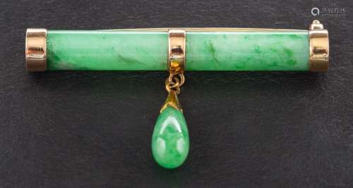 An early twentieth century 18ct gold jade mounted bar brooch...