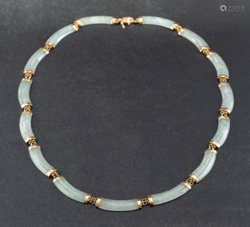 A jadeite necklace,: the polished curved panels of jadeite w...
