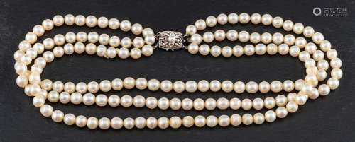 A three row, cultured pearl necklace of uniform size,