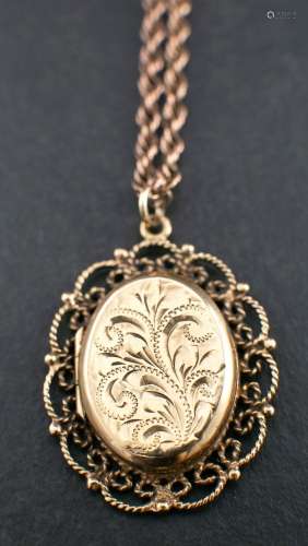 A 9ct gold locket pendant and ropetwist chain,: the locket p...