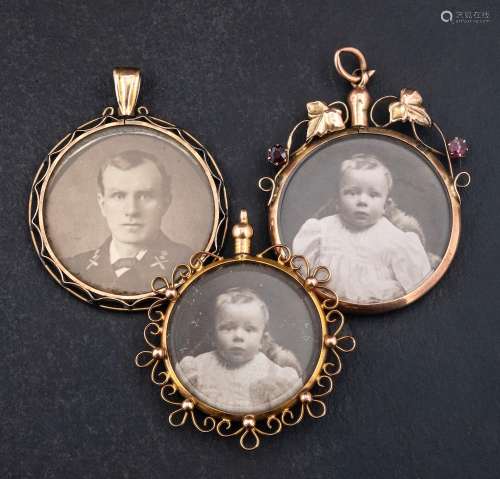 Three pendants set with photographs,: two with 9ct gold hall...