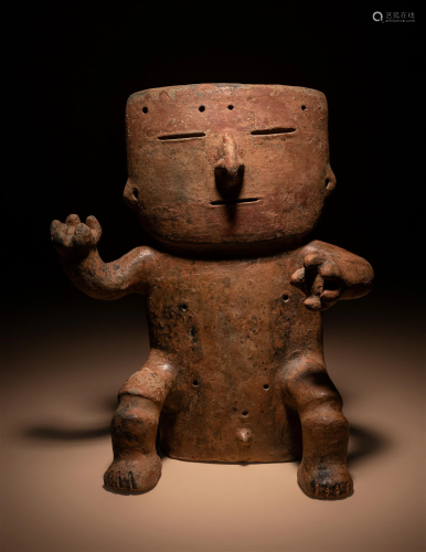 A Quimbaya Terracotta Figure Height 13 13/32 inches (34 cm).