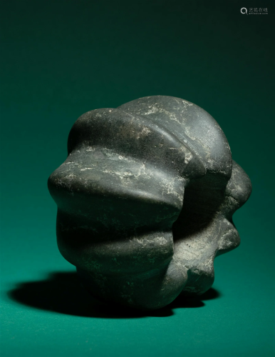 A Chavin Stone Mace Head Diameter 3 3/4 inches (9.6 cm).