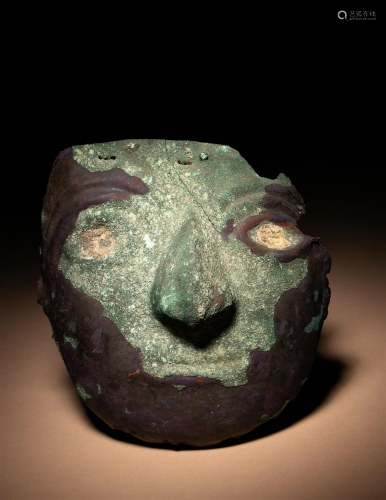 A Moche Copper Ritual Mask Height 6 5/8 inches (17 cm).