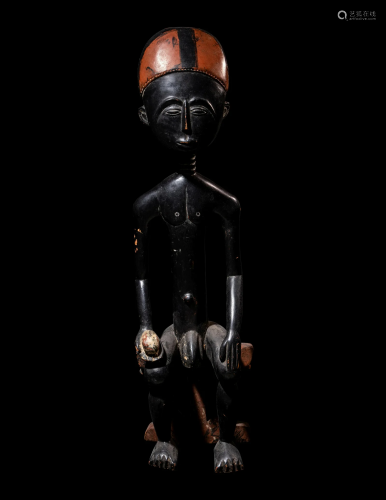 An Akan Wood Figure Seated on a Throne Height 35 11/16 inche...
