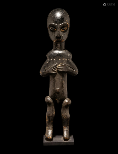 A West African Standing Male Figure Height 15 1/8 inches (38...
