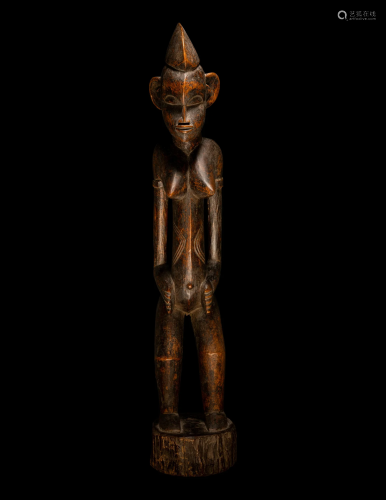 A Baule Wood Standing Female Figure Height 28 inches (71.2 c...
