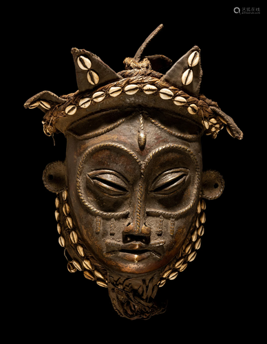 A Chokwe Bronze Mask Height 15 3/4 inches (40 cm).