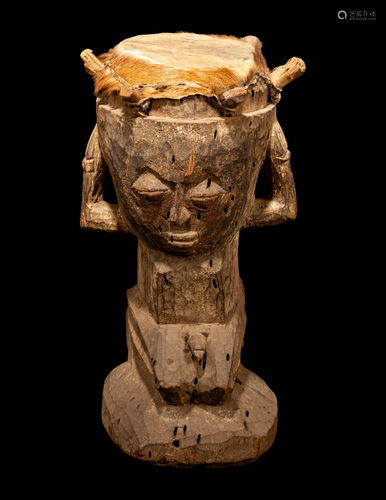 A Yoruba Wood and Hide Drum Height 25 11/16 inches (65.3 cm)...