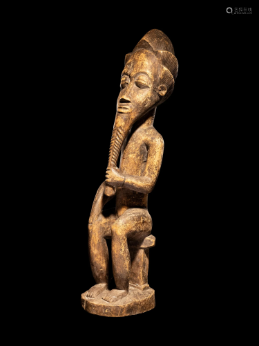 An African Wood Male Figure Height 28 inches (71 cm).
