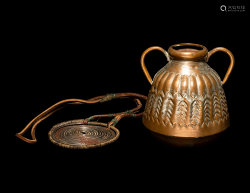 An African Metalwork Pendant and Copper Jar Height of larges...