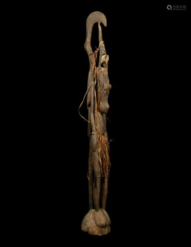 An Oceanic Wood Standing Figure Height 69 1/16 inches (175.5...