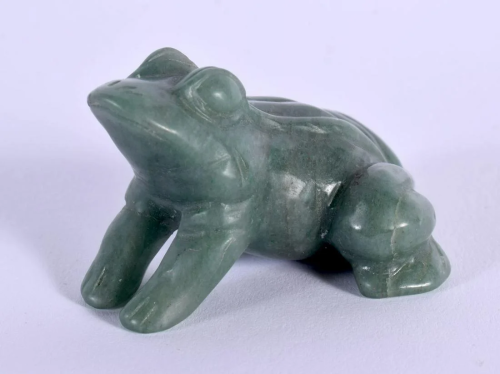 AN EARLY 20TH CENTURY CHINESE CARVED GREEN JADE FIGURE OF A ...