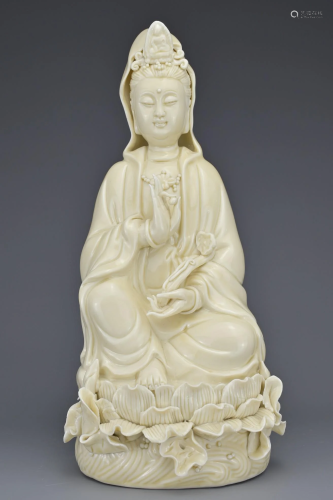 A CHINESE PORCELAIN FIGURE OF GUANYIN
